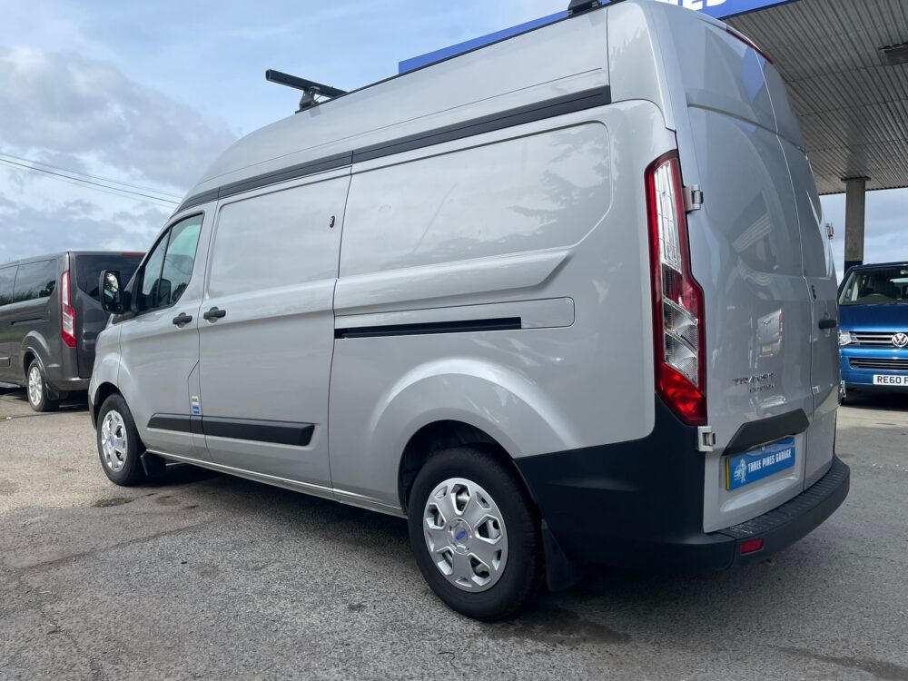 Rear three-quarter view with roof rack